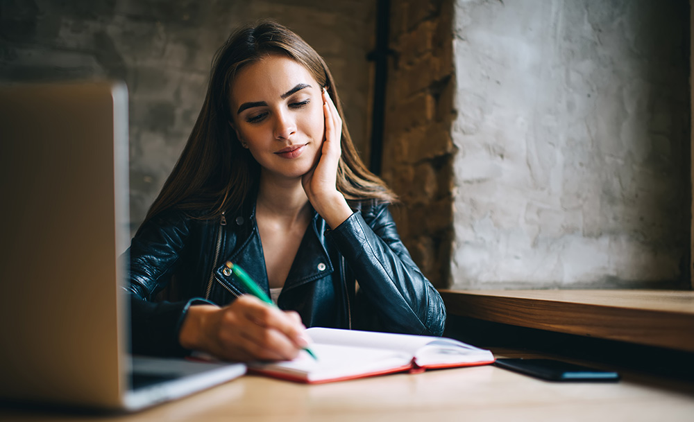 Woman on her laptop learning about SEO and Social Media