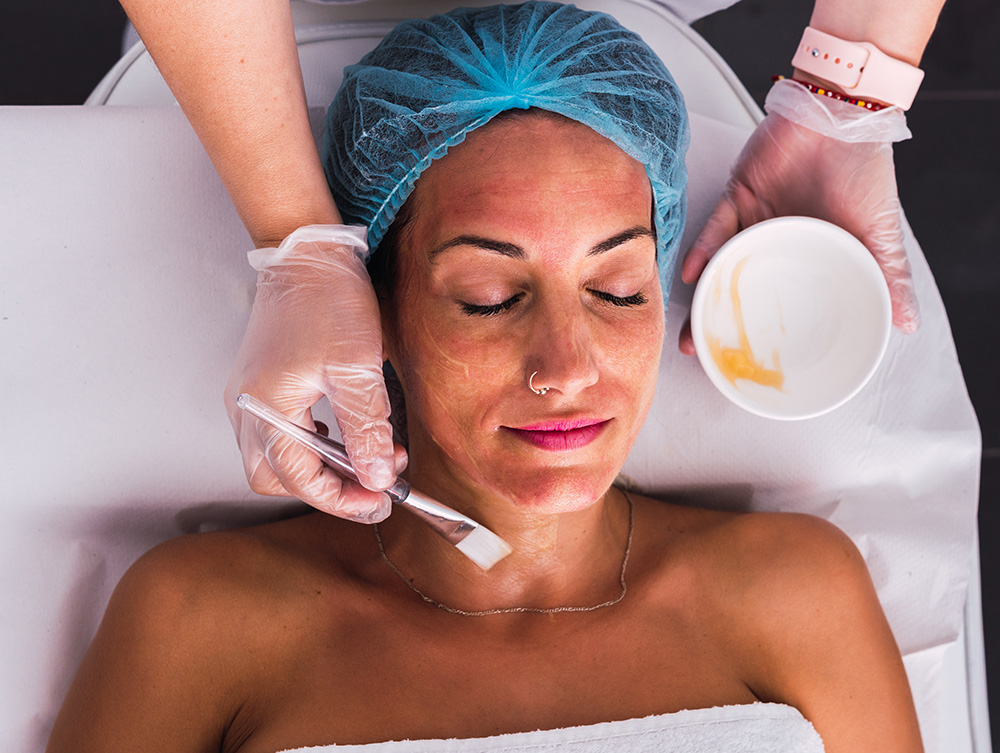 Woman at a medical spa getting a chemical peel